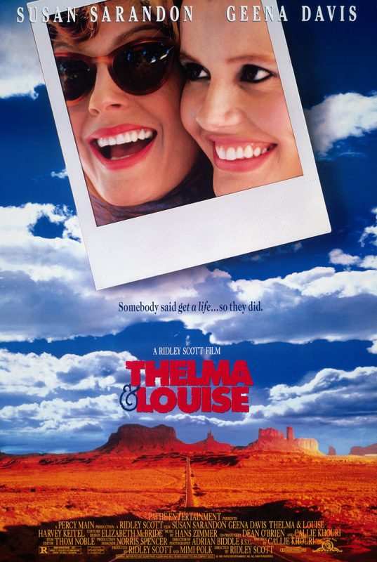 movie poster from Thelma and Louise with title in red in centre against clouds and blue sky above mesa backdrop. Polaroid close up of main characters at top.